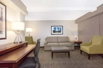 a living room with a couch and chairs at Wyndham Philadelphia-Historic District in Philadelphia