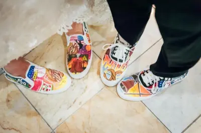 a person wearing shoes with drawings on their feet at Holiday Inn Philadelphia South-Swedesboro by IHG in Swedesboro