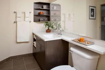 a bathroom with a sink and a toilet and a mirror at Sonesta Simply Suites Philadelphia Mount Laurel in Mount Laurel
