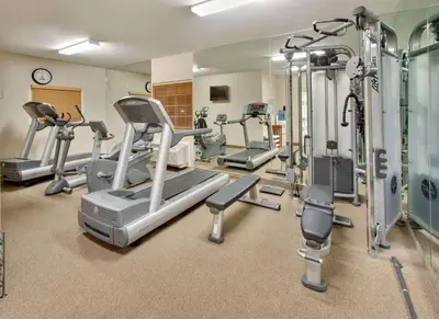 a gym with treadmills and elliptical machines at Sonesta Simply Suites Philadelphia Mount Laurel in Mount Laurel