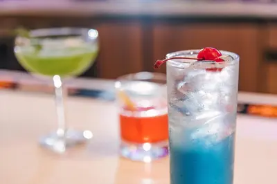 two cocktails sitting on a table with a drink at Holiday Inn Philadelphia-Cherry Hill by IHG in Cherry Hill