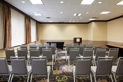 a room with rows of chairs and a podium at Holiday Inn Clark - Newark by IHG in Clark