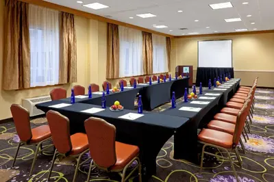 a conference room with a long table and chairs at Holiday Inn Clark - Newark by IHG in Clark