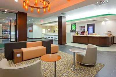 a lobby of a store with a couch and tables at Holiday Inn Clark - Newark by IHG in Clark