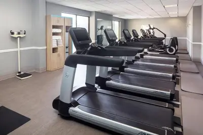 a row of tread machines in a gym at DoubleTree by Hilton Cherry Hill Philadelphia in Cherry Hill