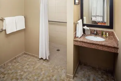a bathroom with a sink and a shower at DoubleTree by Hilton Cherry Hill Philadelphia in Cherry Hill