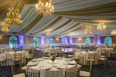 a banquet hall with white tables and chandeliers at DoubleTree by Hilton Cherry Hill Philadelphia in Cherry Hill