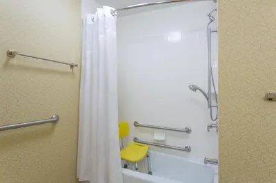 a bathroom with a shower with a shower curtain at Holiday Inn Express Tower Center New Brunswick by IHG in East Brunswick