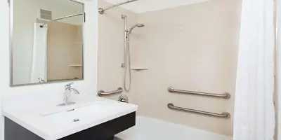 a bathroom with a sink and a shower at Sonesta Simply Suites Nanuet in Nanuet