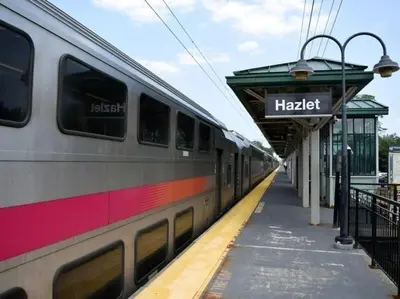 a train stopped at a train station with a platform at Holiday Inn Hazlet by IHG in Hazlet