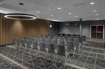 a conference room with chairs and a table at Holiday Inn Hasbrouck Heights-Meadowlands by IHG in Hasbrouck Heights