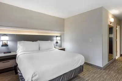 a large white bed in a hotel room at Comfort Inn Paramus - Hackensack in Paramus