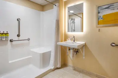 a bathroom with a sink and a shower and a toilet at Comfort Inn Paramus - Hackensack in Paramus