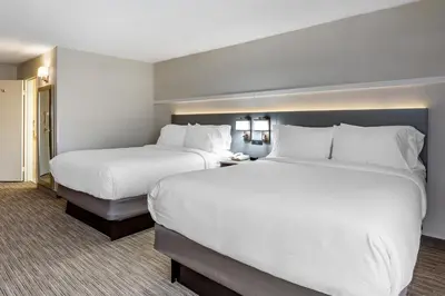 two beds in a hotel room with white pillows at Comfort Inn Paramus - Hackensack in Paramus