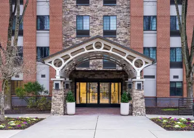 an entrance to a brick building with a large doorway at Homewood Suites by Hilton Parsippany-Troy Hills in Parsippany