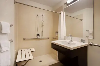 a bathroom with a sink and a shower at Sonesta Simply Suites Somerset in Somerset