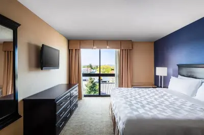 a hotel room with a bed and a television at Holiday Inn South Plainfield-Piscataway by IHG in South Plainfield