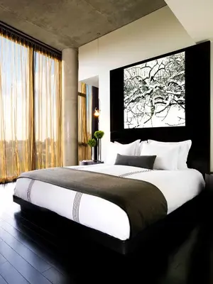 a bedroom with a large bed with a large window at Sixty LES in New York
