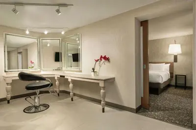 a hotel room with a desk and a bed at Hilton Garden Inn Springfield in Springfield