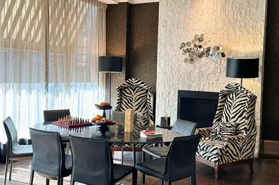 a dining room with a table and chairs at Moderne Hotel in New York