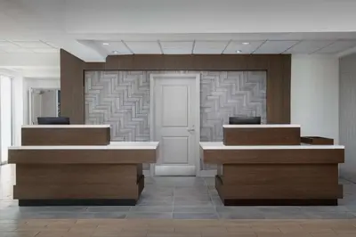 a lobby with two reception desks in a building at Hilton Garden Inn Wilkes-Barre in Wilkes-Barre