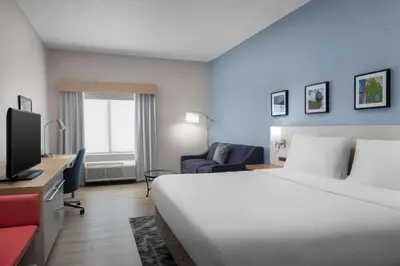 a hotel room with a bed and a tv at Hilton Garden Inn Wilkes-Barre in Wilkes-Barre
