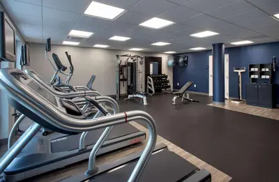 a gym with several treadmills and a treadmill at Hampton Inn Middletown in Middletown