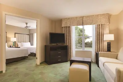 a hotel room with a bed and a television at Homewood Suites Harrisburg-West Hershey Area in Mechanicsburg