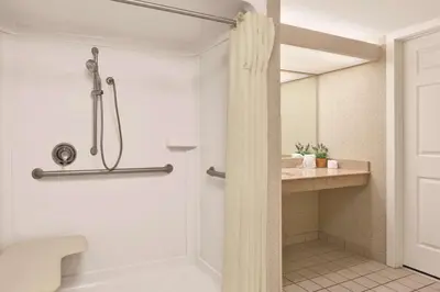 a bathroom with a shower and a toilet at Homewood Suites Harrisburg-West Hershey Area in Mechanicsburg