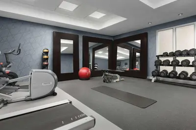 a fitness room with a treadmill and a gym at Homewood Suites by Hilton Reading-Wyomissing in Wyomissing