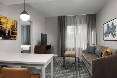 a living room with a couch and a table at Homewood Suites by Hilton Reading-Wyomissing in Wyomissing