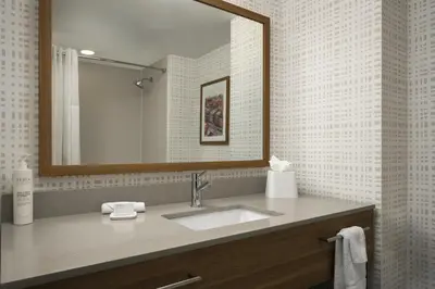 a bathroom with a sink and a mirror at Hampton Inn - York in York