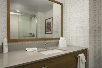 a bathroom with a sink and a mirror at Hampton Inn - York in York