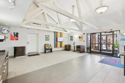 an office with a waiting room with chairs at Motel 6-Piscataway, NJ in Piscataway