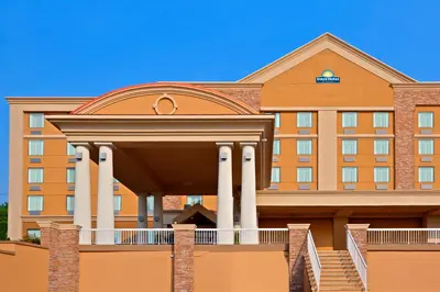 a hotel building with a building with columns at Days Hotel by Wyndham North Bergen in North Bergen