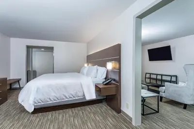 a hotel room with a bed and a chair at Holiday Inn Express Exton - Great Valley by IHG in Exton