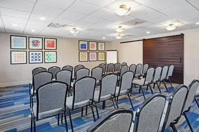 a row of chairs in a room with a board at Holiday Inn Express Exton - Great Valley by IHG in Exton