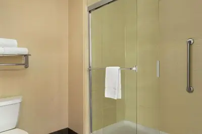 a bathroom with a glass shower with a toilet at Homewood Suites by Hilton Allentown-Bethlehem Airport in Bethlehem