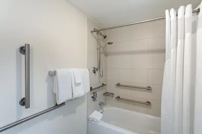 a bathroom with a tub and a toilet and a sink at Holiday Inn Express Hotel & Suites Philadelphia - King of Prussia by IHG in King of Prussia