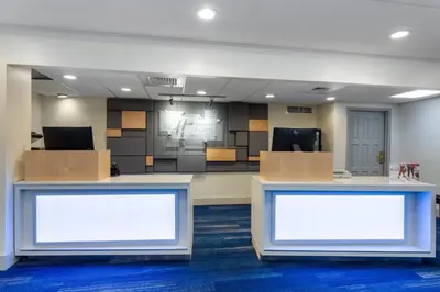 an office with two white screens in a room at Holiday Inn Express Hotel & Suites Philadelphia - King of Prussia by IHG in King of Prussia