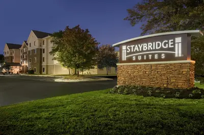 a sign for the ishybridge village suites at Staybridge Suites Wilmington-Newark by IHG in Newark