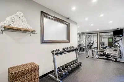 a fitness room with a gym with tread machines at Staybridge Suites Wilmington-Newark by IHG in Newark