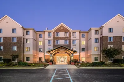 an empty parking lot in front of a large building at Staybridge Suites Wilmington-Newark by IHG in Newark