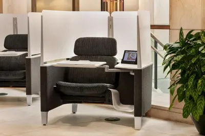 an office chair sitting in front of a mirror at Crowne Plaza Hotel Philadelphia - King of Prussia by IHG in King of Prussia