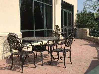 a table and chairs sitting on a patio at Crowne Plaza Hotel Philadelphia - King of Prussia by IHG in King of Prussia