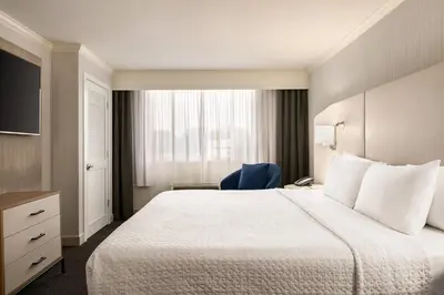 a hotel room with a large bed and a window at Crowne Plaza Hotel Philadelphia - King of Prussia by IHG in King of Prussia