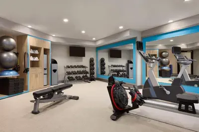 a gym with two treadmills and exercise equipment at Crowne Plaza Hotel Philadelphia - King of Prussia by IHG in King of Prussia