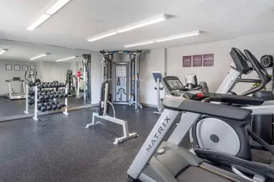 a fitness room with a gym with tread machines at Executive Residency by Best Western Philadelphia-Willow Grove in Horsham
