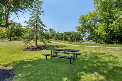 a picnic table in a park with a tree at Executive Residency by Best Western Philadelphia-Willow Grove in Horsham