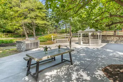 a picnic table in a park with a gazebo at Executive Residency by Best Western Philadelphia-Willow Grove in Horsham